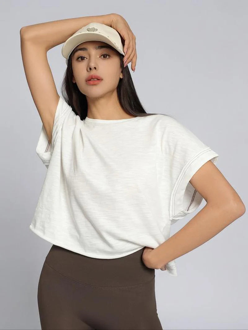 Women's Plain Cut Out Asymmetrical Hem Batwing Sleeve Tee | zäh